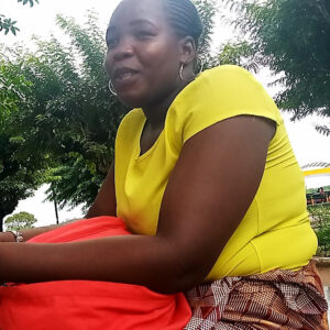 Naila Sitting With Her Booklet